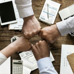 People putting their hands together in triumph
