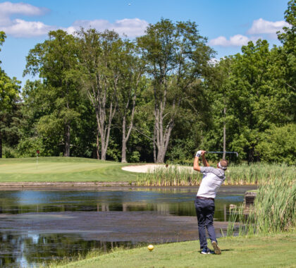 Man golfing at Hueston Woods Lodge