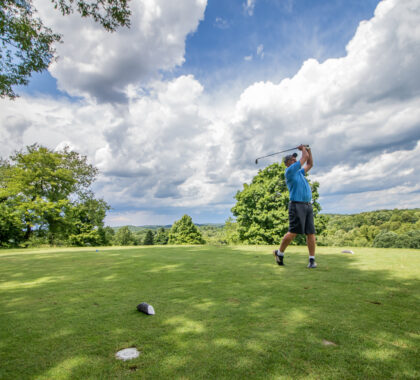 Man golfing at Salt Fork Park Lodge