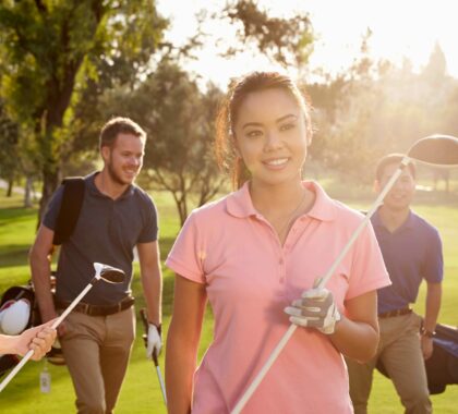 Young people golfing