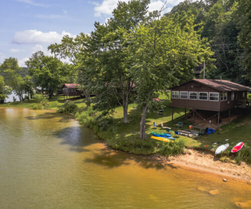 a cabins sits along the water at salt fork