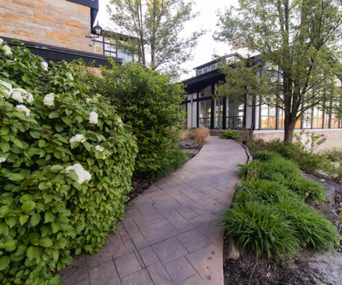 a landscaped path wides around the exterior of punderson